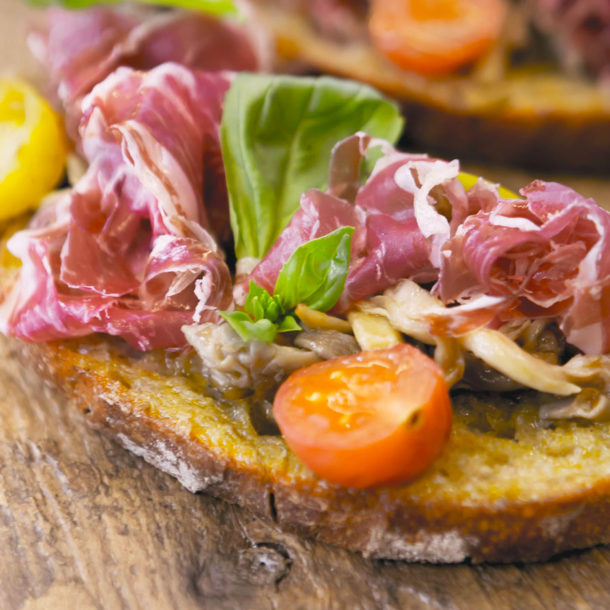 Pata negra tosta with oyster mushroom, cherry tomatoes and basil